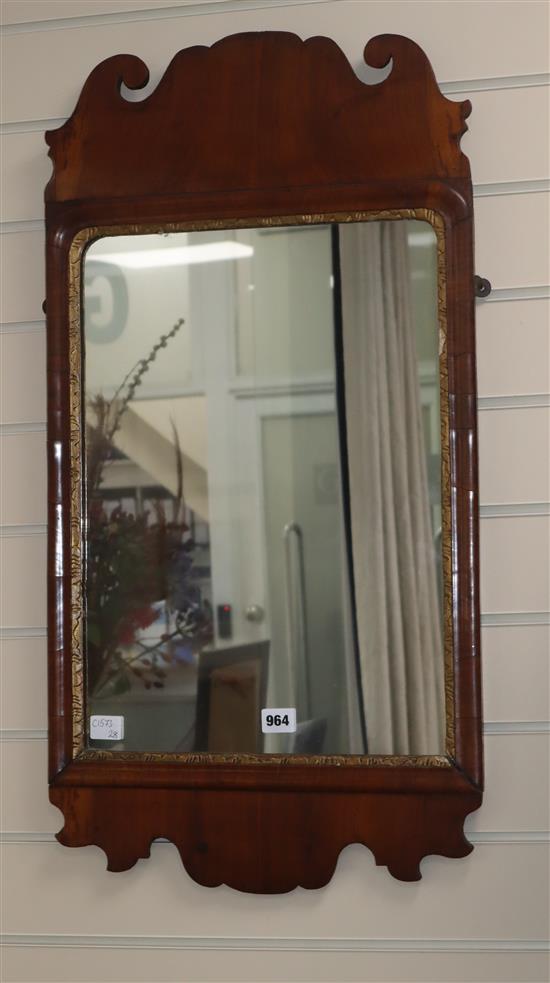 A walnut fret frame mirror